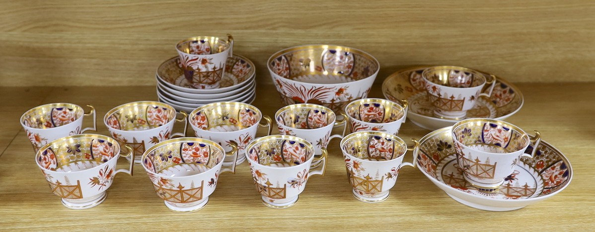 A Spode part Imari tea service consisting of six London shape tea cups, coffee cups and saucers, two graduated saucer dishes and a bowl pattern 1495